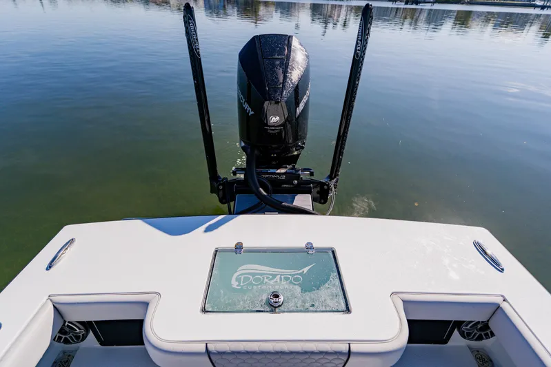  Yacht Photos Pics 2024 Dorado 25 boat with Mercury engine on calm water.