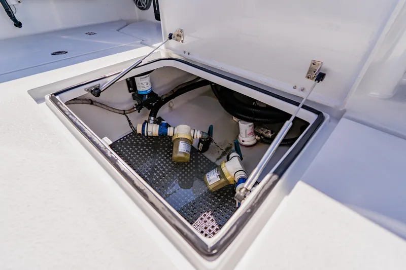 Yacht Photos Pics Open hatch of 2024 Dorado 25 boat showing internal components and wiring.