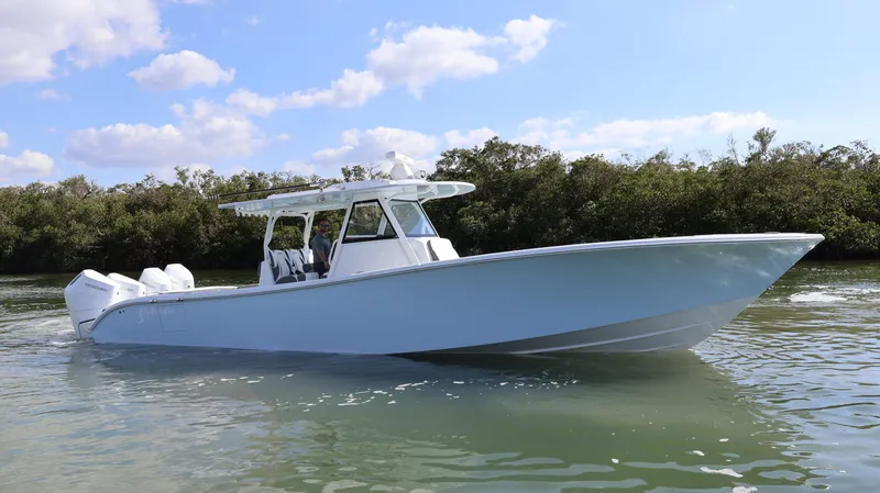  Yacht Photos Pics 2025 Yellowfin 39 Offshore boat on calm water, clear sky background.
