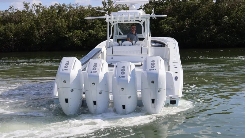  Yacht Photos Pics 2025 Yellowfin 39 Offshore boat with quad outboard engines on water.