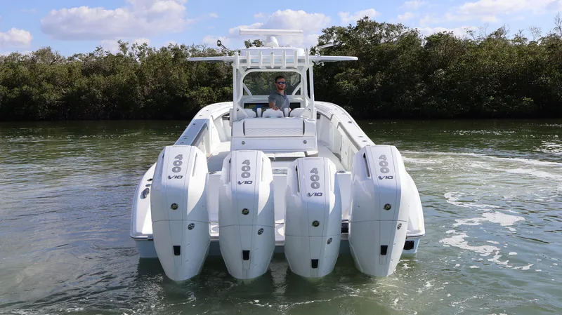  Yacht Photos Pics 2025 Yellowfin 39 Offshore boat with four powerful outboard engines on the water.