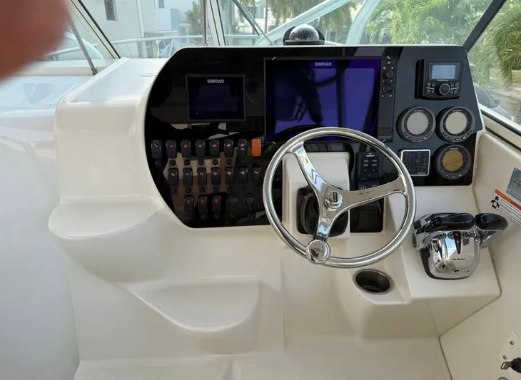  Yacht Photos Pics 2008 Hydra-Sports Vector 2800 WA boat dashboard with steering wheel and control panel.