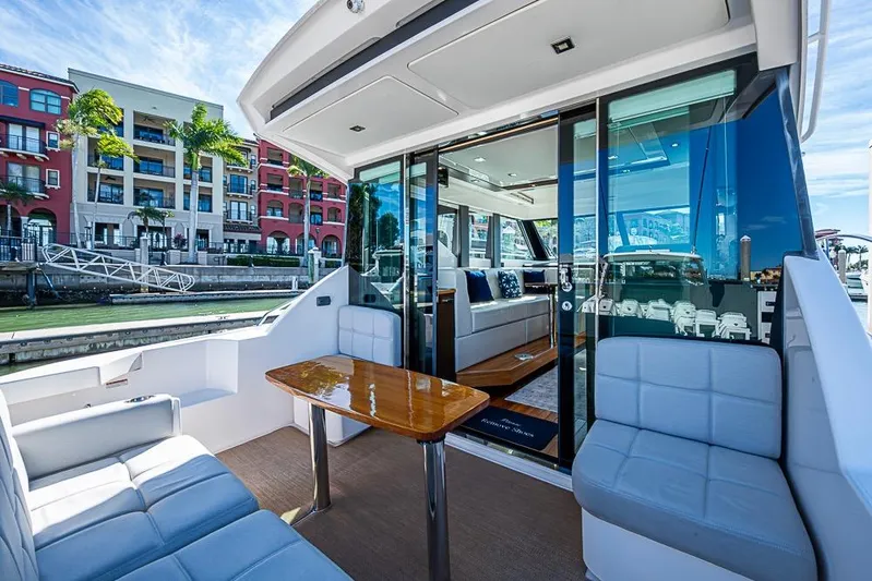 Exitevent Yacht Photos Pics 2017 Tiara Yacht Coupe with elegant seating and waterfront view.