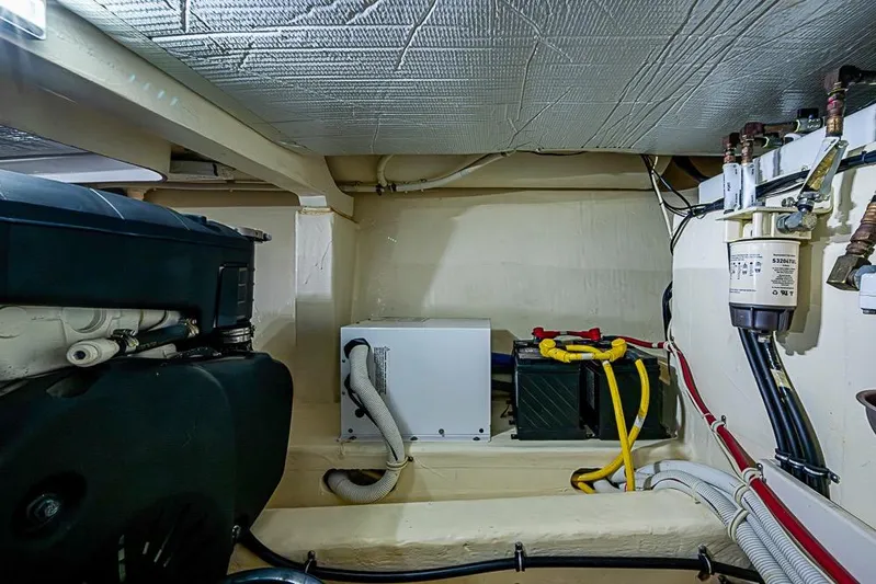 Exitevent Yacht Photos Pics Engine room of a 2017 Tiara Yacht coupe, showcasing mechanical components and wiring.
