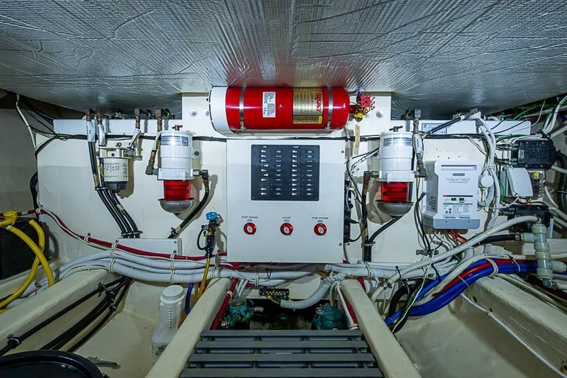 Exitevent Yacht Photos Pics Engine room of a 2017 Tiara Yacht Coupe, featuring wiring and control systems.