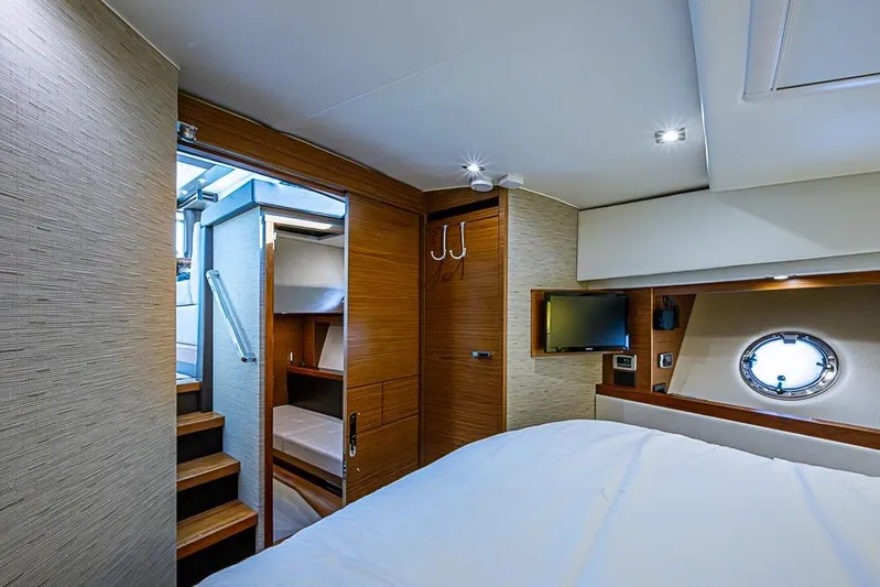 Exitevent Yacht Photos Pics Luxurious 2017 Tiara Yacht coupe interior with modern bedroom and porthole window.