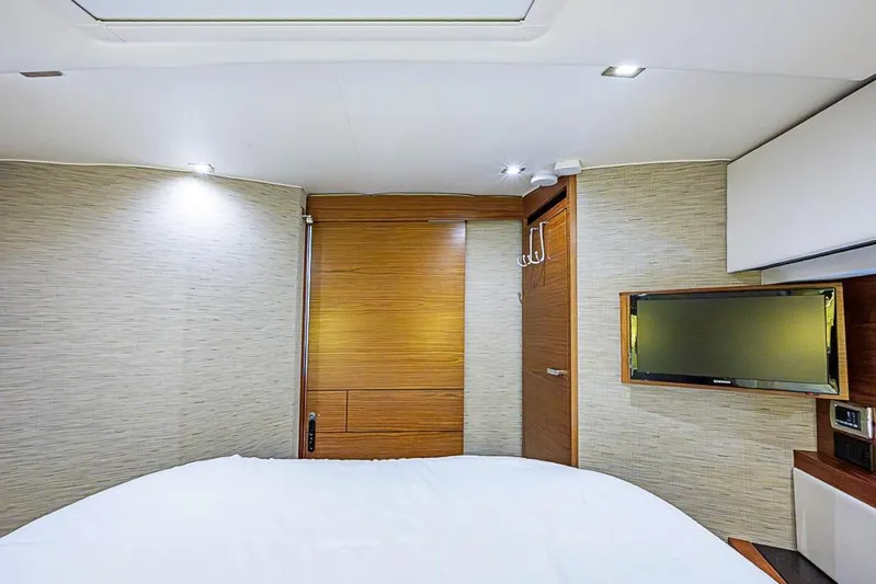 Exitevent Yacht Photos Pics Luxurious interior of 2017 Tiara Yacht Coupe with modern design and flat-screen TV.