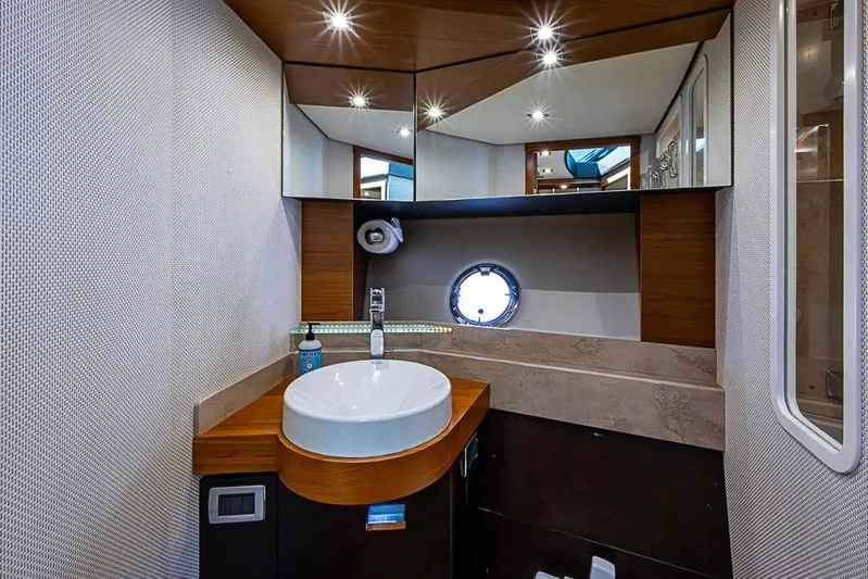 Exitevent Yacht Photos Pics Luxurious 2017 Tiara Yacht coupe bathroom with modern sink and elegant wood accents.