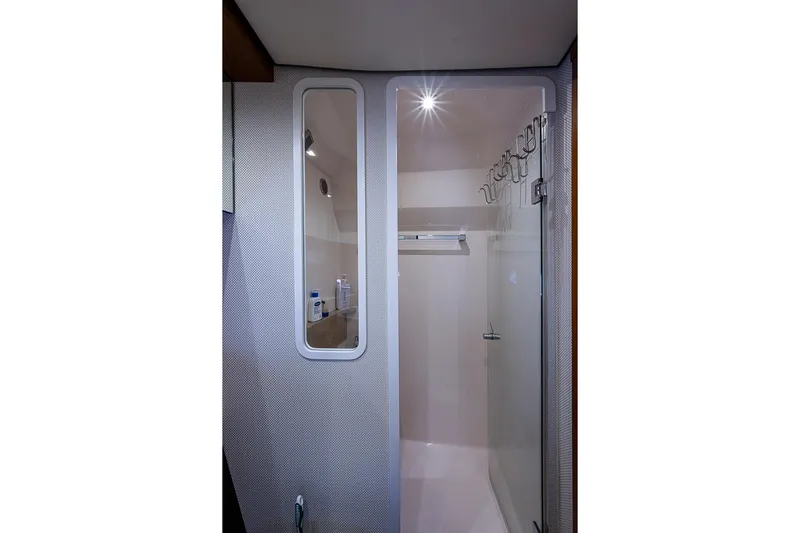 Exitevent Yacht Photos Pics 2017 Tiara Yacht coupe bathroom with modern shower and sleek design.