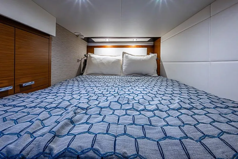 Exitevent Yacht Photos Pics Luxurious 2017 Tiara Yacht coupe bedroom with elegant bedding and modern design.