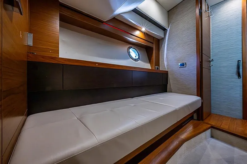 Exitevent Yacht Photos Pics 2017 Tiara Yacht Coupe interior with sleek wood finish and comfortable seating.