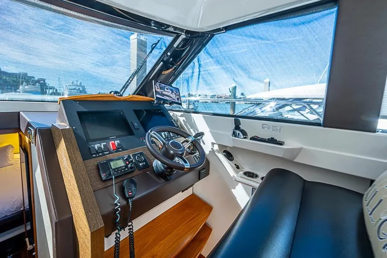 Exitevent Yacht Photos Pics 2017 Tiara Yacht Coupe helm with modern controls and panoramic view.