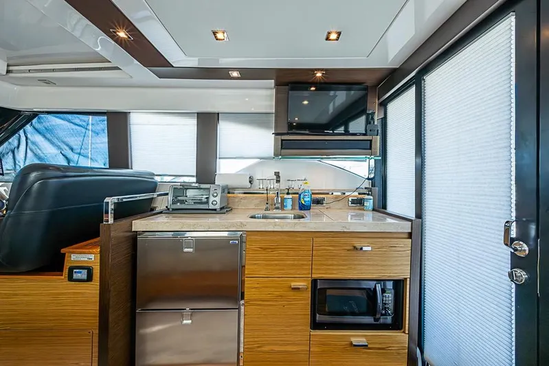 Exitevent Yacht Photos Pics Luxurious 2017 Tiara Yacht coupe interior with modern kitchen amenities and sleek design.