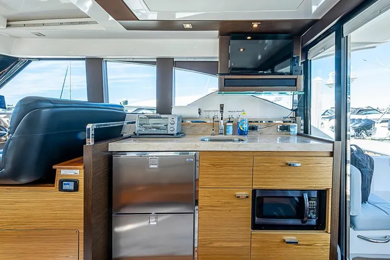 Exitevent Yacht Photos Pics 2017 Tiara Yacht coupe interior with modern kitchen amenities and sleek design.