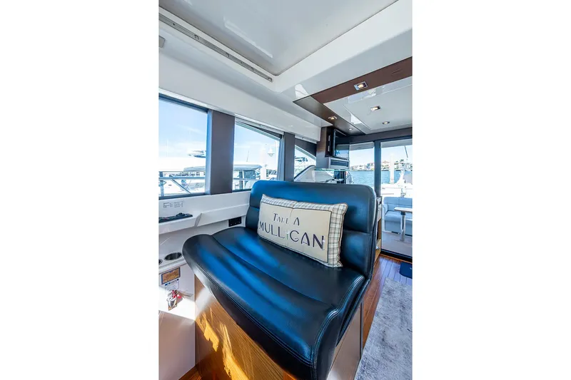 Exitevent Yacht Photos Pics Interior of 2017 Tiara Yacht Coupe with leather seating and decorative pillow.