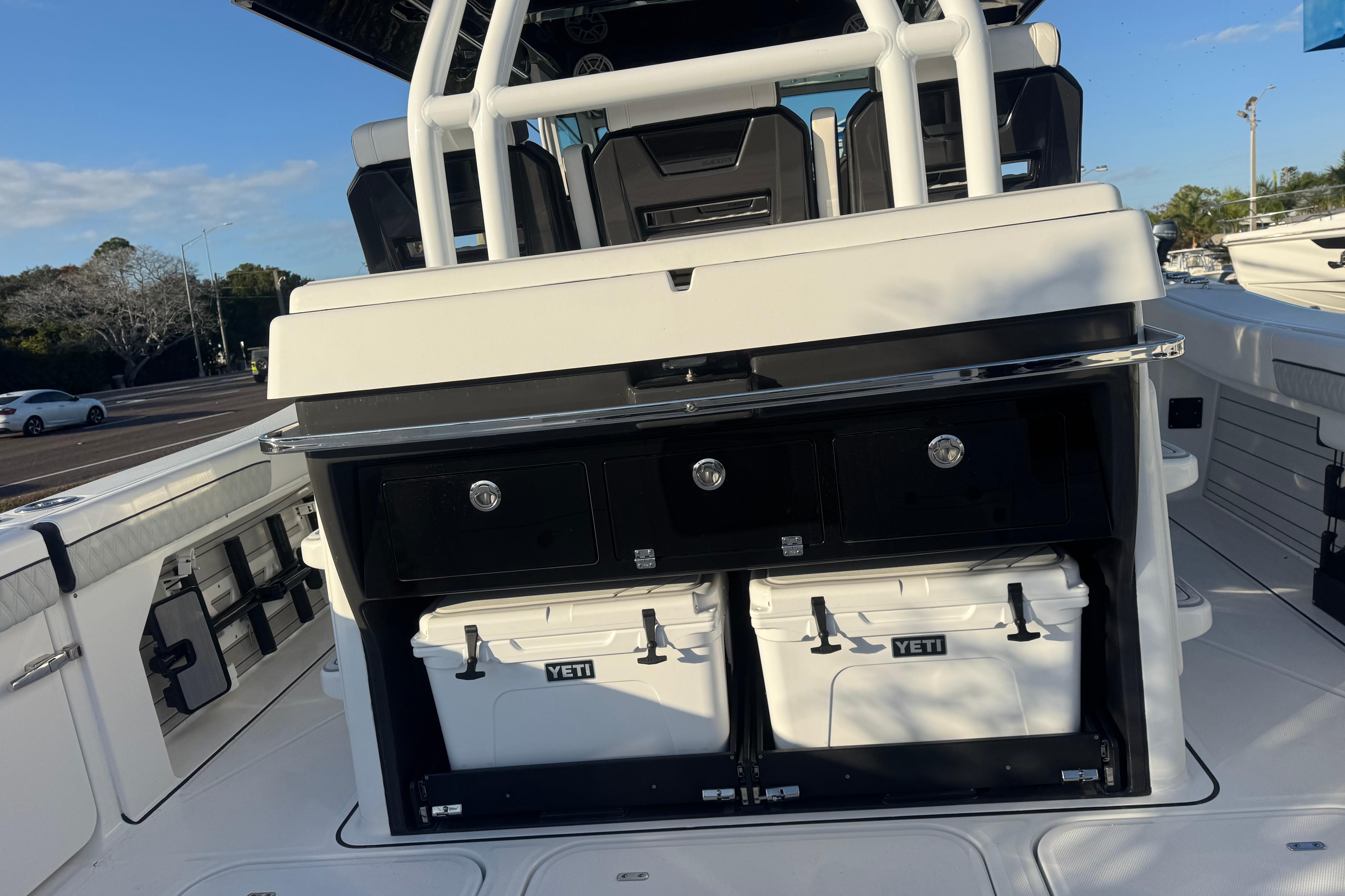 2026 Blackfin 400 CC boat interior with storage and Yeti coolers.