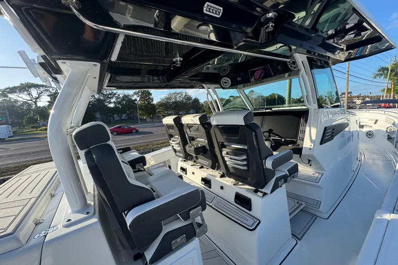  Yacht Photos Pics 2026 Blackfin 400 CC boat interior with sleek seating and modern dashboard.