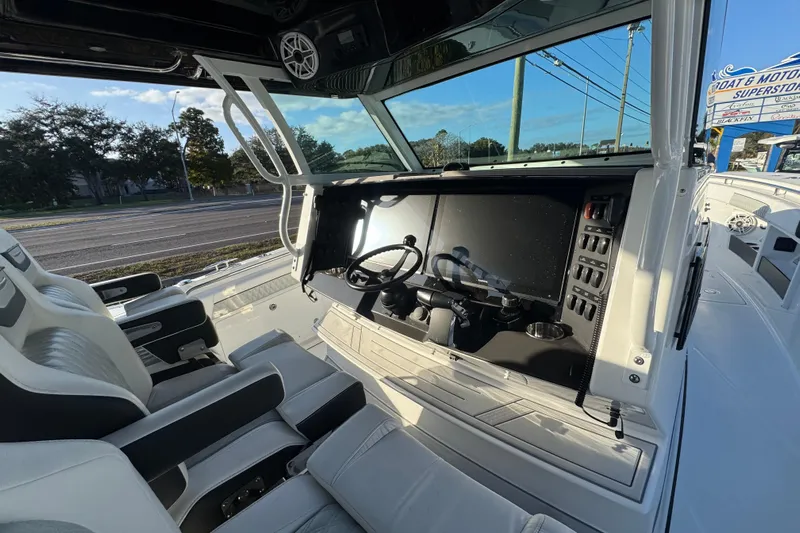  Yacht Photos Pics 2026 Blackfin 400 CC boat cockpit with modern controls and seating.