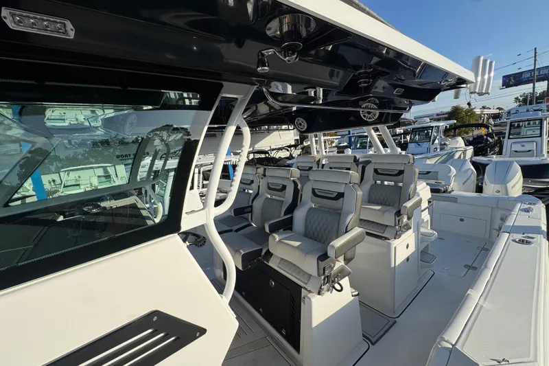  Yacht Photos Pics 2026 Blackfin 400 CC boat interior with luxurious seating and modern design.