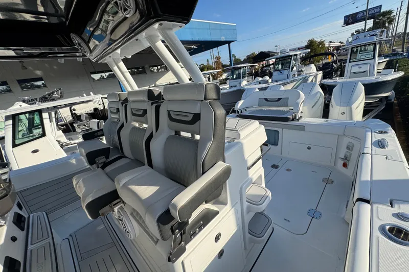  Yacht Photos Pics 2026 Blackfin 400 CC boat interior with luxurious seating and modern design.