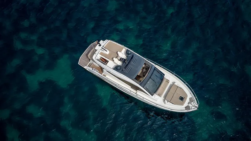  Yacht Photos Pics 2020 Cranchi E 52S Evoluzione yacht on clear blue water, aerial view.