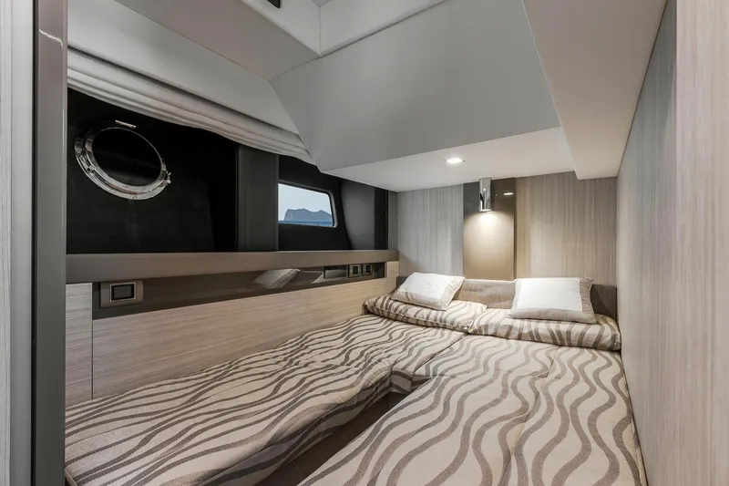  Yacht Photos Pics Luxurious cabin interior of 2020 Cranchi E 52S Evoluzione yacht with twin beds.