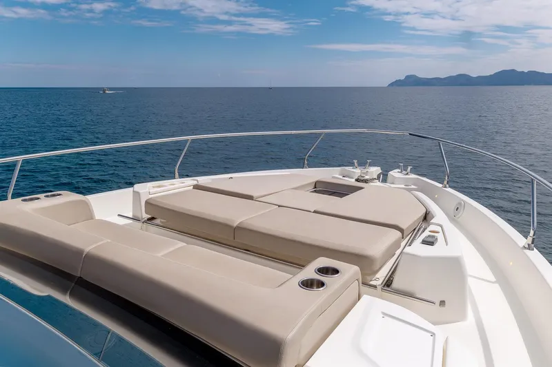 Yacht Photos Pics Luxurious 2020 Cranchi E 52S Evoluzione yacht deck with sun loungers, ocean view.
