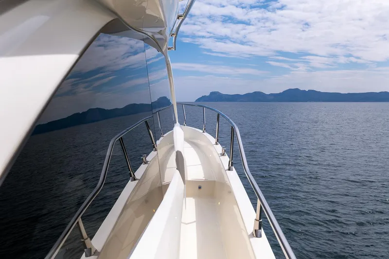  Yacht Photos Pics Side view of 2020 Cranchi E 52S Evoluzione yacht cruising on open water.