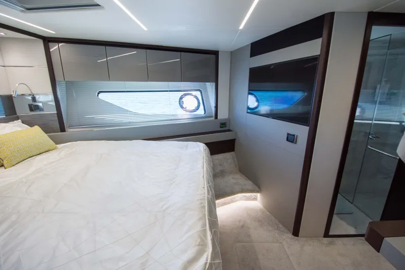  Yacht Photos Pics Luxurious bedroom interior of 2020 Sunseeker Predator 74 XPS yacht with modern design.