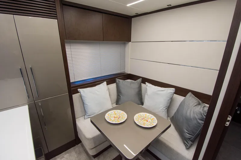  Yacht Photos Pics Luxurious dining area in 2020 Sunseeker Predator 74 XPS yacht with modern decor.