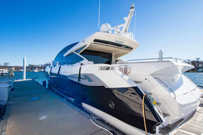  Yacht Photos Pics Sunseeker Predator 74 XPS 2020 yacht docked, showcasing sleek design and luxury features.