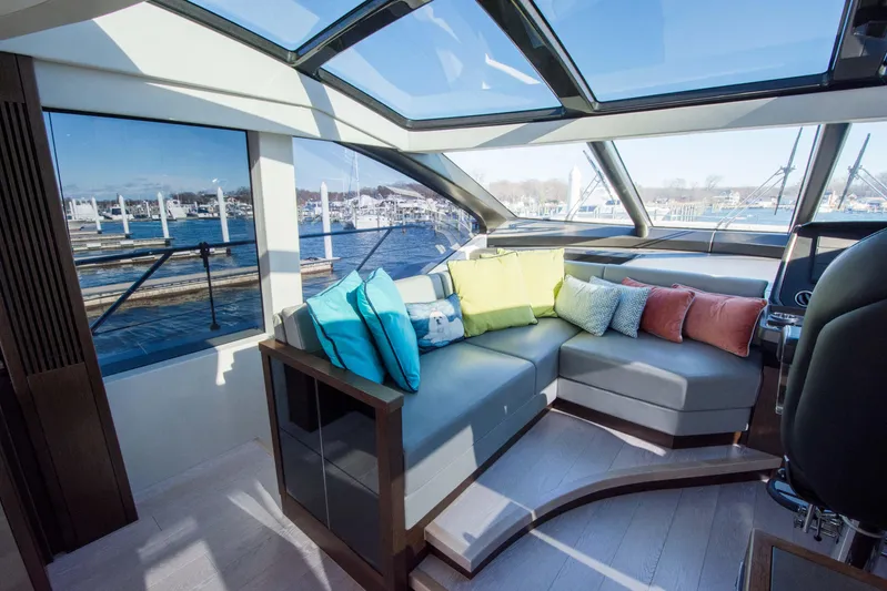  Yacht Photos Pics Luxurious Sunseeker Predator 74 XPS yacht interior with colorful cushions, panoramic windows, and sleek design.