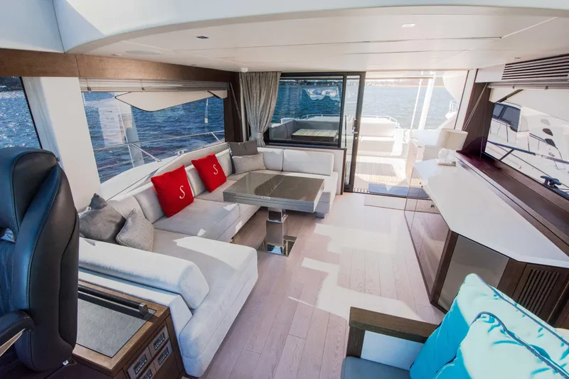  Yacht Photos Pics Luxurious interior of 2020 Sunseeker Predator 74 XPS yacht with elegant seating and ocean view.