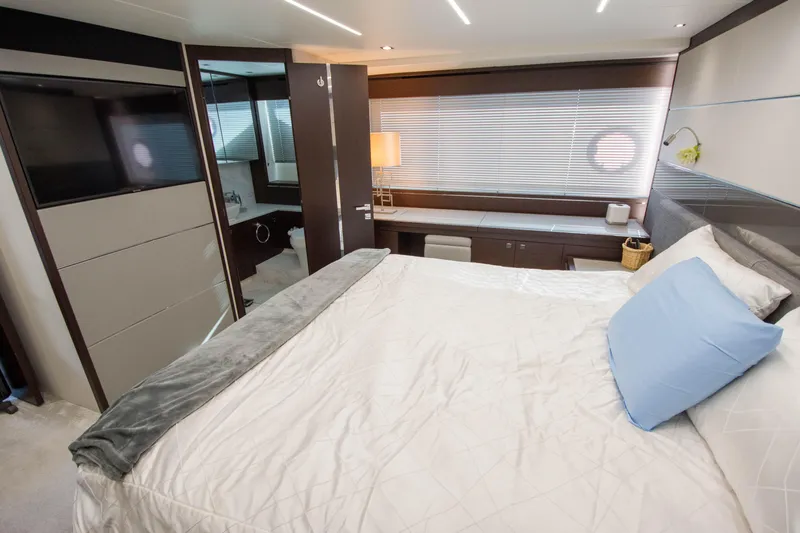  Yacht Photos Pics Luxurious bedroom interior of 2020 Sunseeker Predator 74 XPS yacht with modern design.