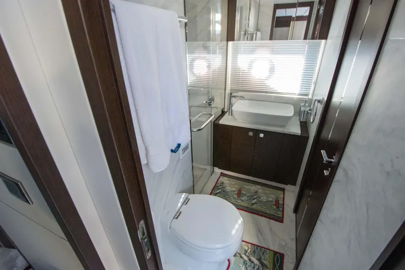  Yacht Photos Pics Luxurious bathroom in 2020 Sunseeker Predator 74 XPS yacht, featuring modern fixtures and elegant design.