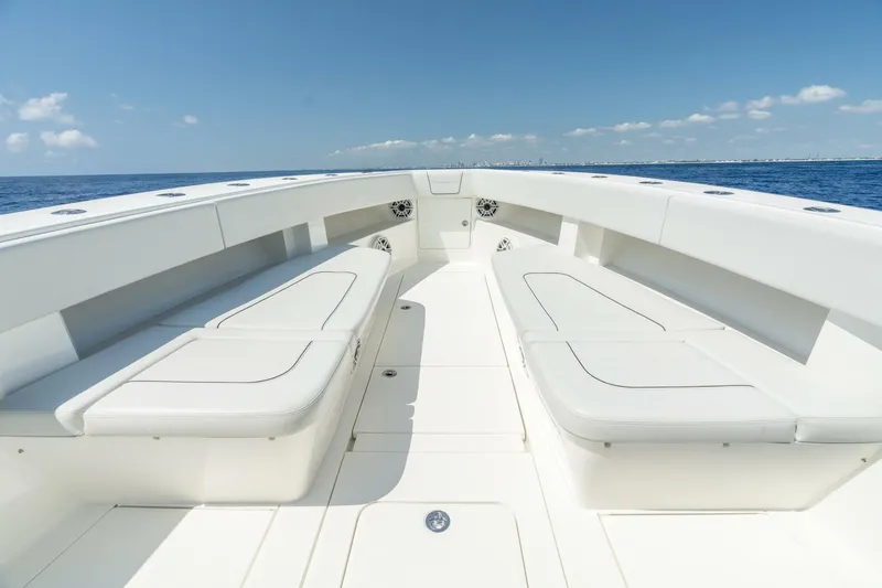 Zero Beach Yacht Photos Pics 2021 SeaVee 390Z boat interior with white seating and ocean view.
