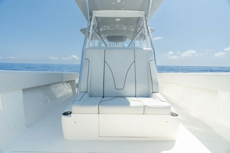 Zero Beach Yacht Photos Pics 2021 SeaVee 390Z boat interior with sleek seating, ocean view, and clear sky.