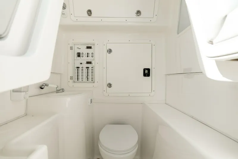 Zero Beach Yacht Photos Pics 2021 SeaVee 390Z boat interior with toilet and control panel.