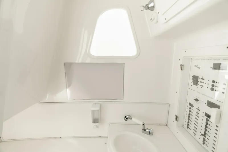 Zero Beach Yacht Photos Pics 2021 SeaVee 390Z interior cabin with sink and control panel.
