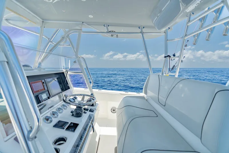 Zero Beach Yacht Photos Pics 2021 SeaVee 390Z boat interior with ocean view, featuring modern helm and seating.