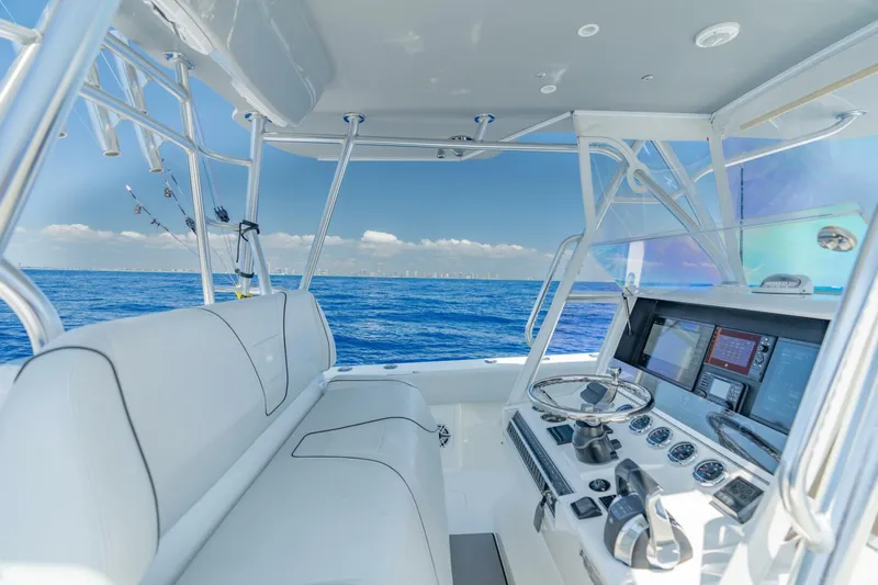 Zero Beach Yacht Photos Pics 2021 SeaVee 390Z boat interior with ocean view, featuring modern navigation equipment.