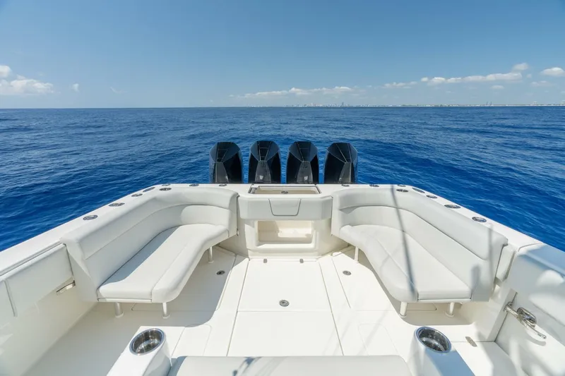 Zero Beach Yacht Photos Pics 2021 SeaVee 390Z boat with spacious deck and four engines on open sea.