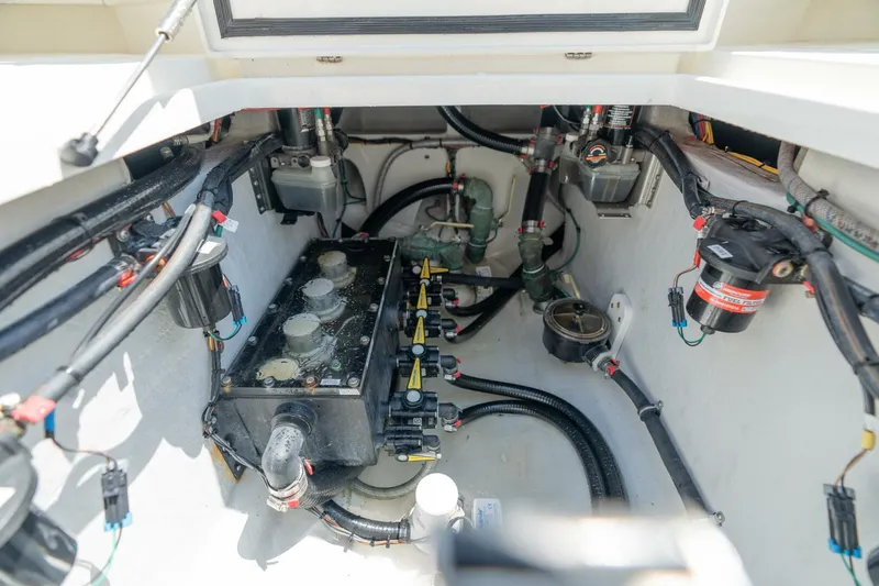Zero Beach Yacht Photos Pics Engine compartment of a 2021 SeaVee 390Z boat, showcasing wiring and components.