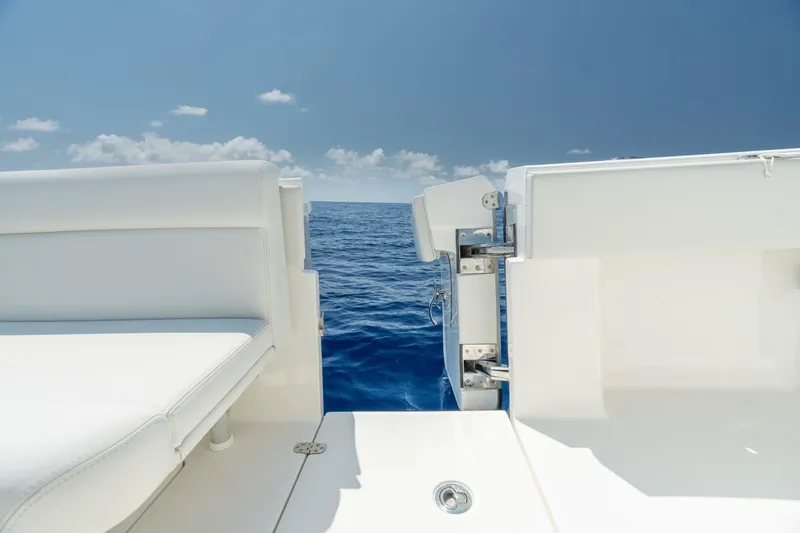 Zero Beach Yacht Photos Pics 2021 SeaVee 390Z boat with open transom door, ocean view.