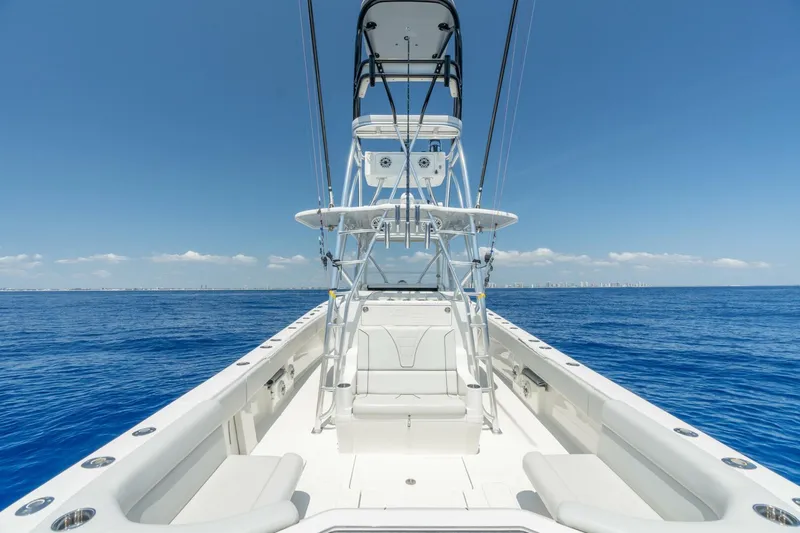 Zero Beach Yacht Photos Pics 2021 SeaVee 390Z boat on open ocean, clear sky, spacious deck view.