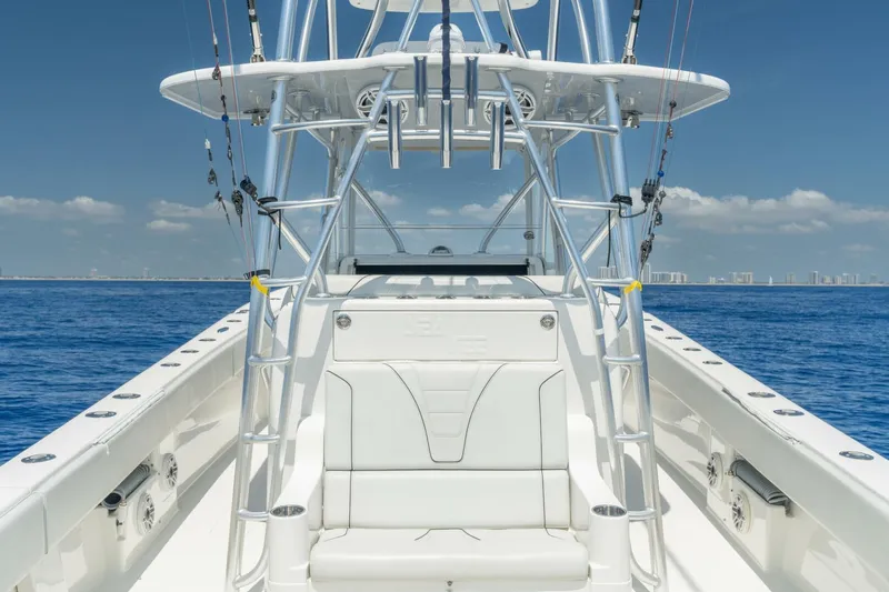 Zero Beach Yacht Photos Pics 2021 SeaVee 390Z boat on open water, featuring sleek design and fishing equipment.