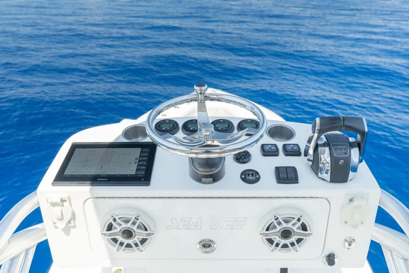Zero Beach Yacht Photos Pics 2021 SeaVee 390Z boat helm with navigation controls and ocean view.