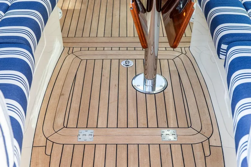 Gracious Yacht Photos Pics Teak deck and striped seating on 2011 Hinckley Picnic Boat Mark III.