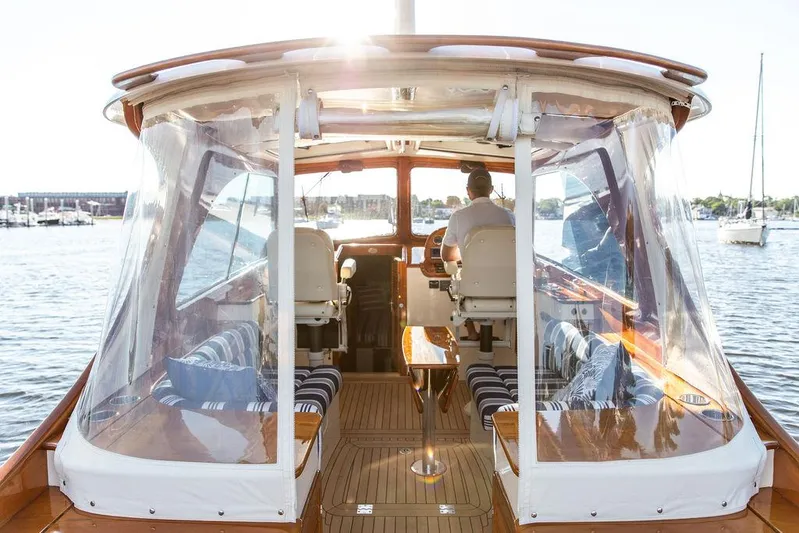 Gracious Yacht Photos Pics Hinckley Picnic Boat Mark III, 2011, interior view with clear canopy and seating, on water.