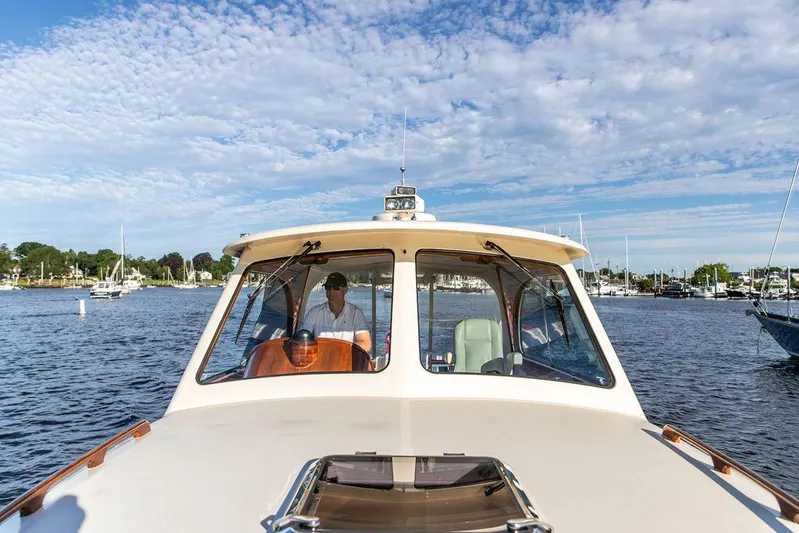 Gracious Yacht Photos Pics 2011 Hinckley Picnic Boat Mark III cruising on a sunny day with scenic harbor views.